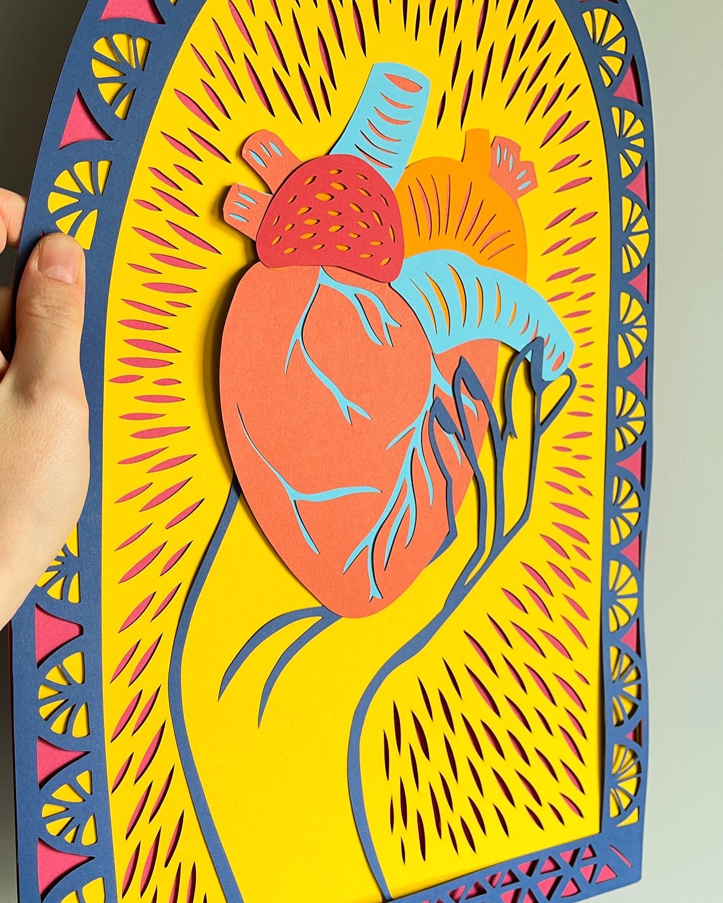 Colourful Held Heart Papercutting